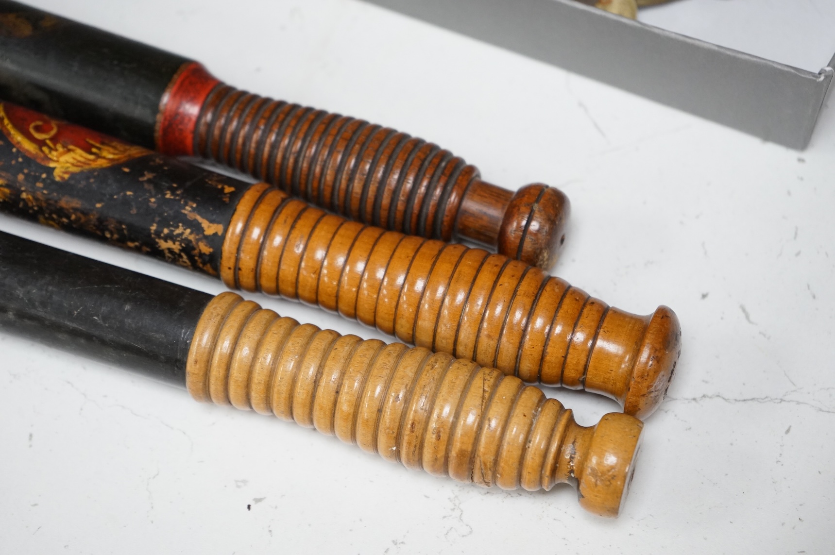 A Victorian Scottish Special Constable’s turned and painted wood truncheon, and two other Victorian Police truncheons, largest 46cm in length (3)